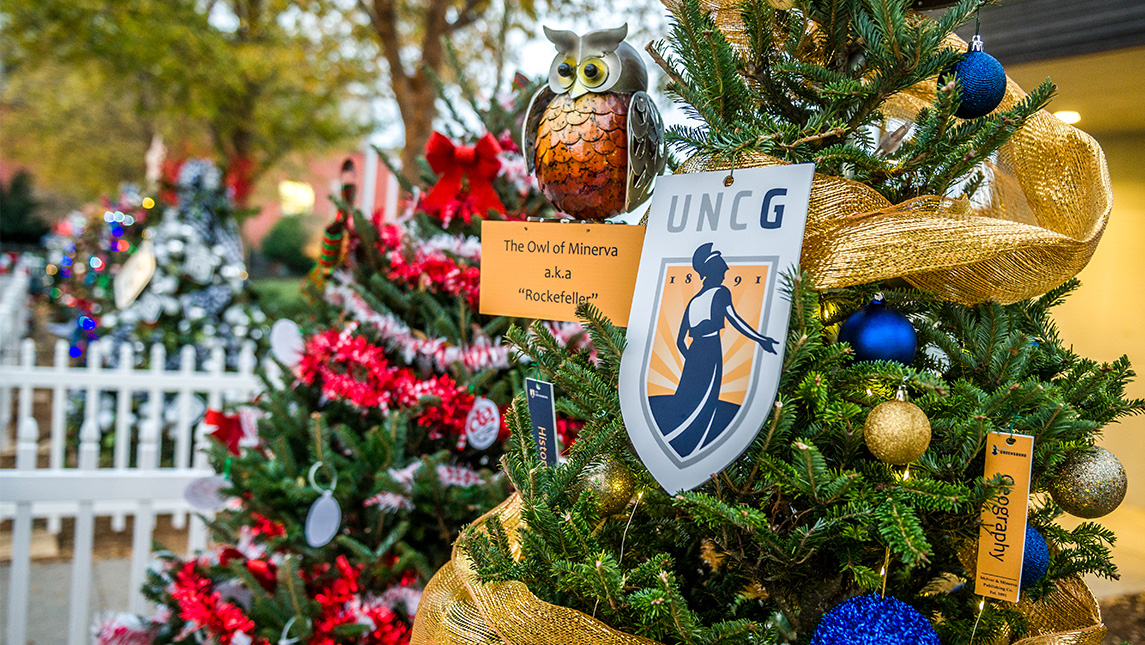 UNCG-themed ornaments hang from a Christmas tree.