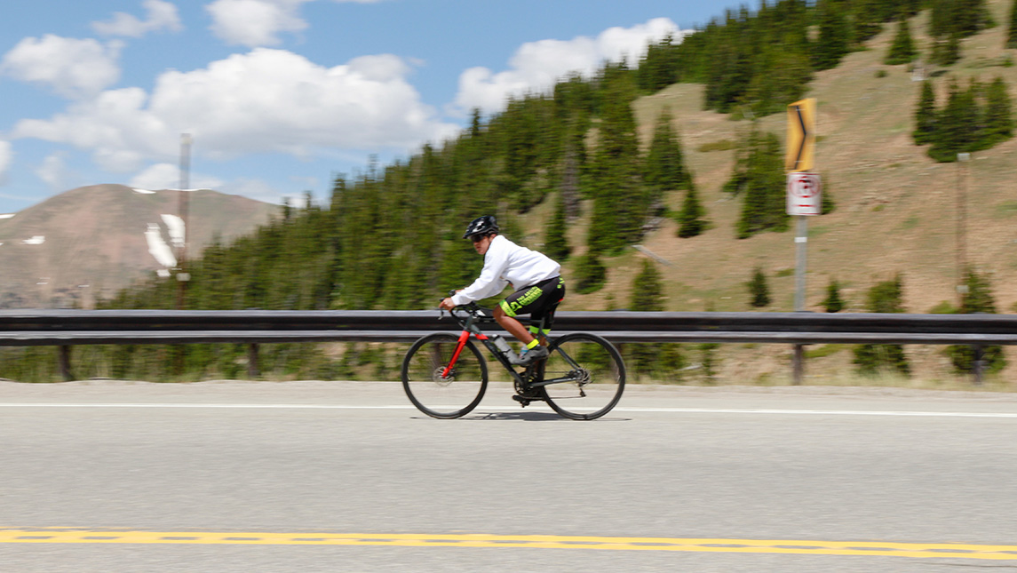 UNCG student Giovanni Martinez rides a bike