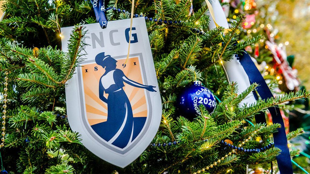 A Christmas tree ornament depicts the UNCG logo.