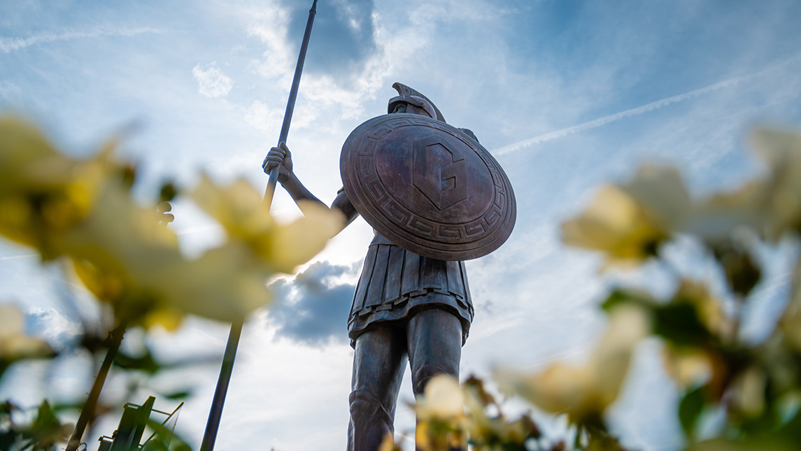 The UNCG Spartan statue stands guard over campus.