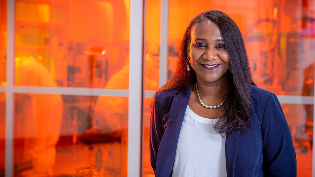 Dr. Sherine Obare stands outside one of the labs at UNCG's JSNN building.