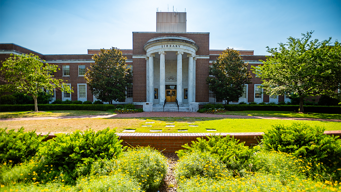The sun shines down on UNCG's Jackson Library.