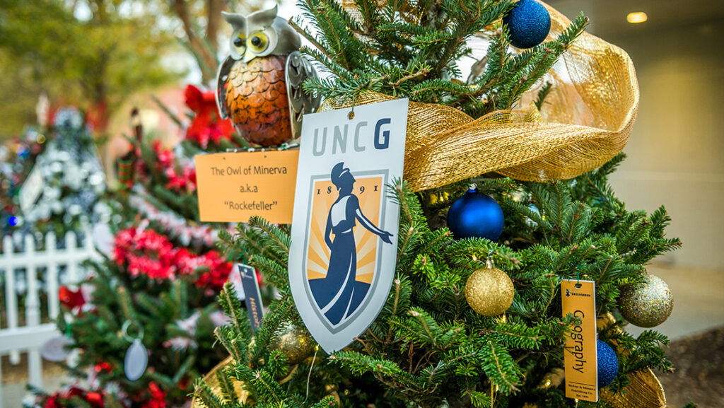 UNCG-themed ornaments decorate a Christmas tree.