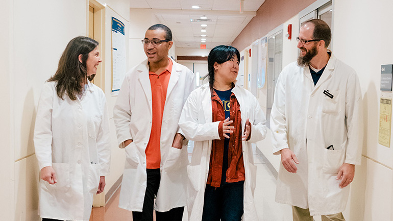 UNCG Students in hallway of lab building.