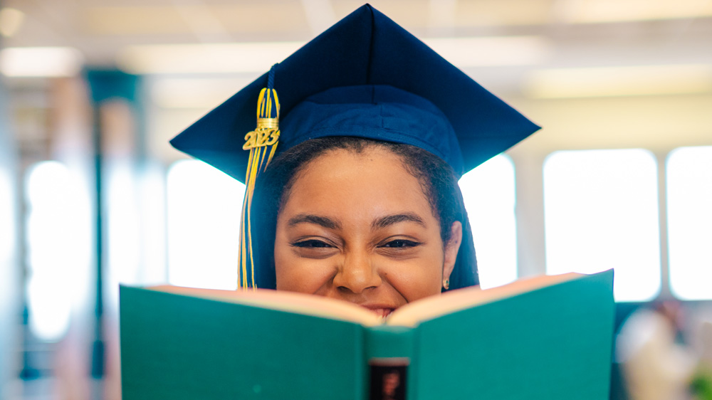 UNCG Graduate Dana Broadus in UNCG's Jackson Library.