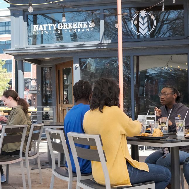 Students dine on the patio at Natty Greene's.