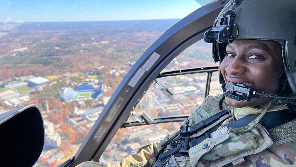 UNCG alumna Lindsey Jefferies Jones '18 in the cockpit of a helicopter.