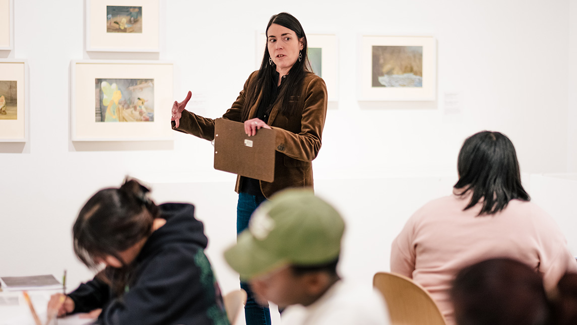 UNCG Professor Heather Holian speaks to students at the Weatherspoon Art Museum.