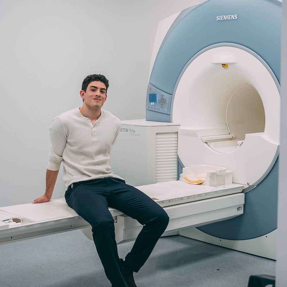 Sebastian Rodriquez sitting on MRI table