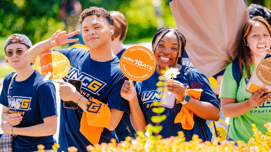 Students in Spartan t-shirts and daisies on the first day of classes.