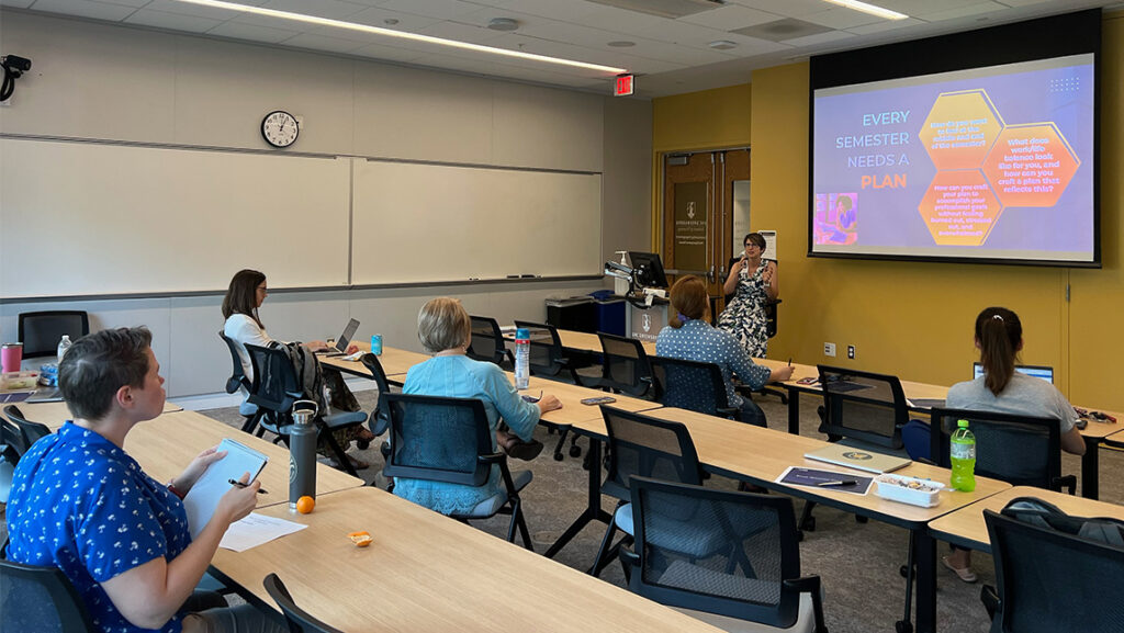 Faculty sit in a class led by former Senate Chair Tami Draves.