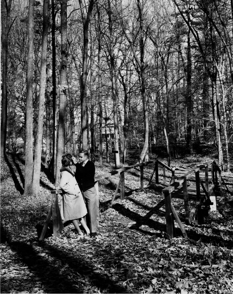 Two UNCG students meet in Peabody Park.