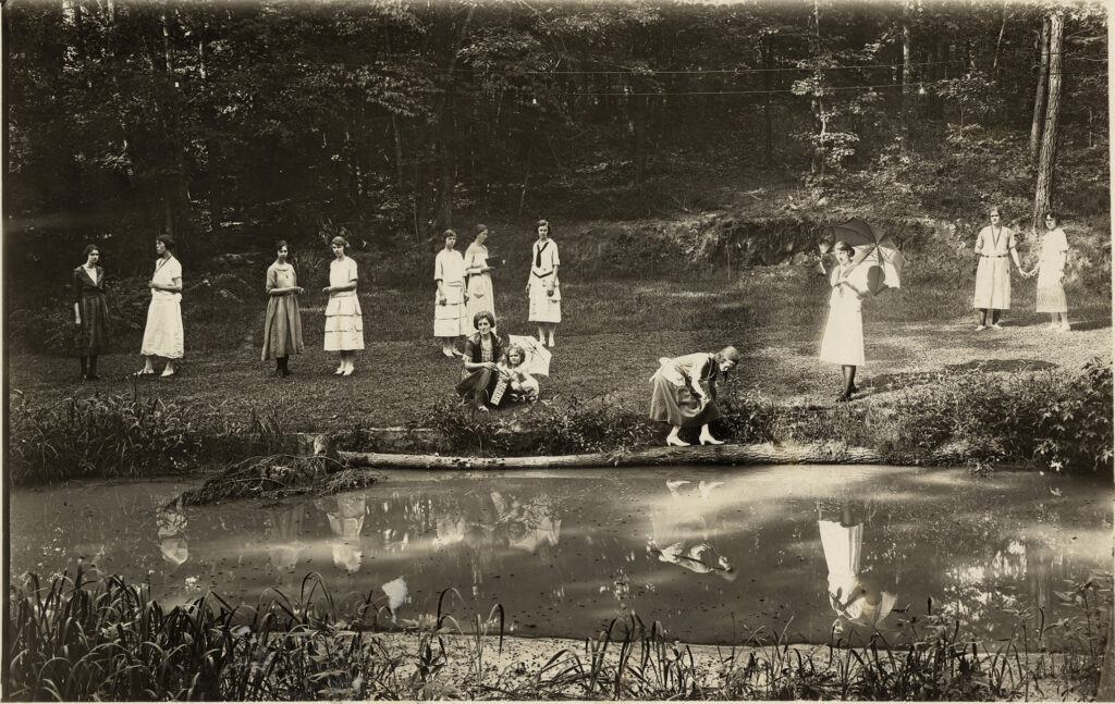 Students stand around Peabody Park.