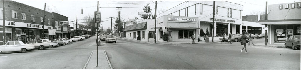 Panoramic black-and-white photo of Tate Street in Greensboro.