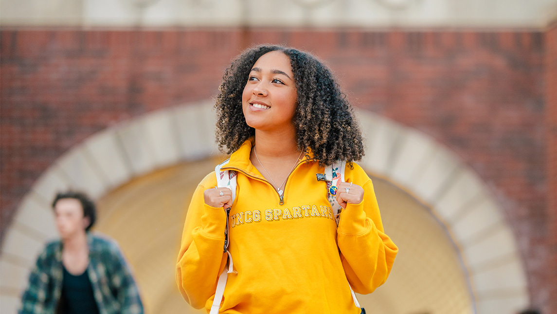 A UNCG student walks out of the Gate City tunnel.