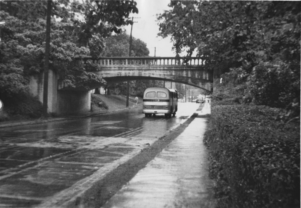 Black and white photo of a bridge that used to pass over Walker Avenue near UNCG.