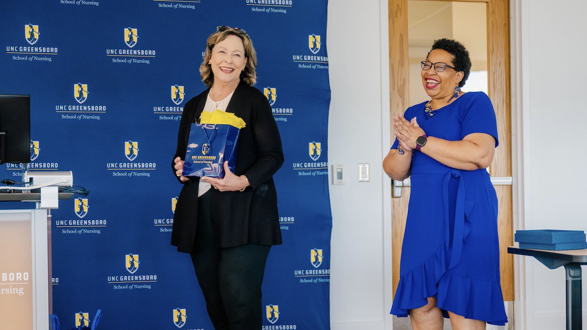 Dr. Barksdale presenting Alumni award to Dr. Robin Bartlett at UNCG School of Nursing.