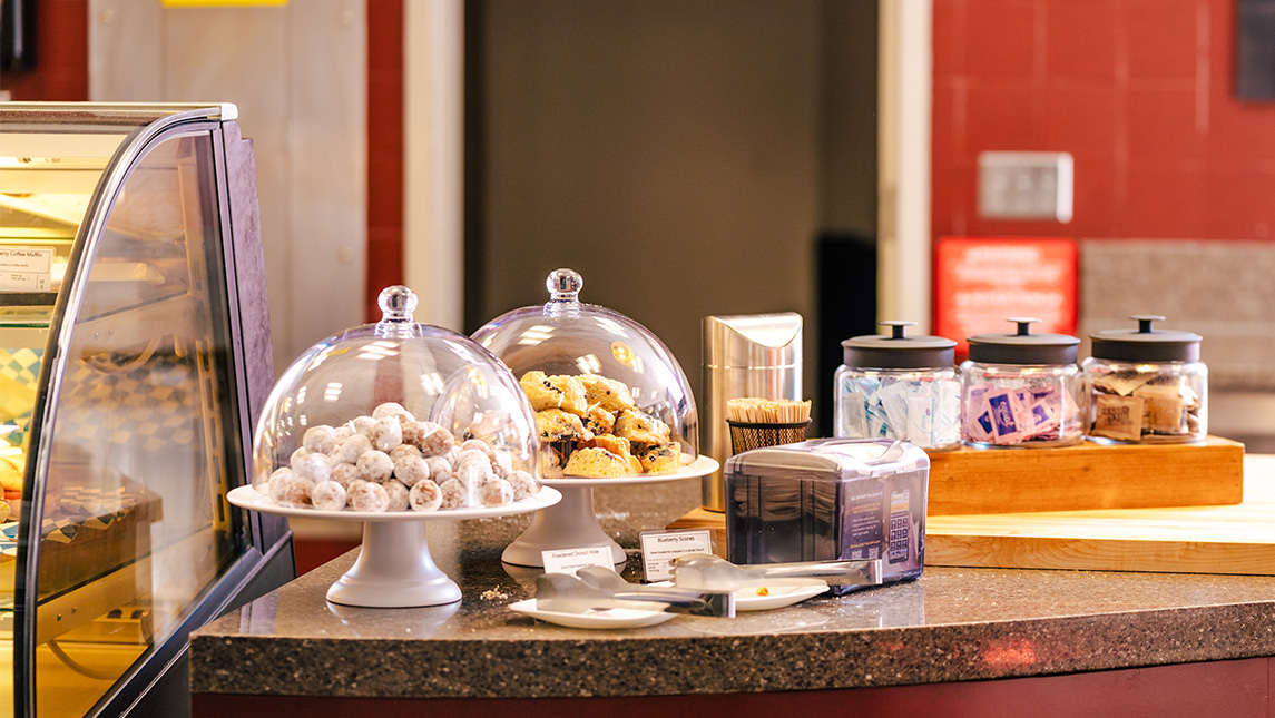 Glass-covered platters of pastries at UNCG Spartan Dining.