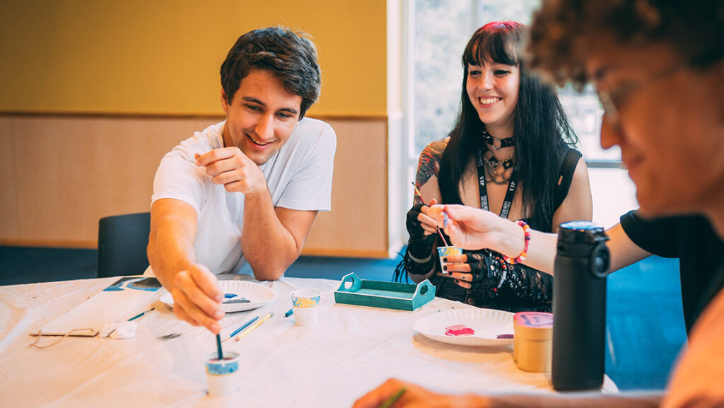 UNCG students paint together.