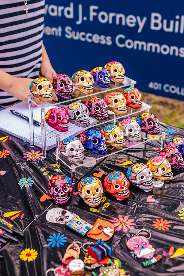 Decorative skull ornaments sold by a UNCG student on College Avenue.